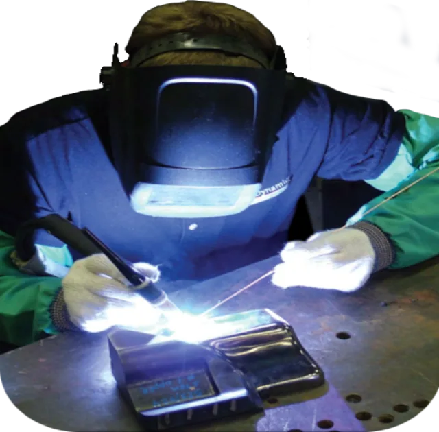 Welder TIG welding a die detail at Tool Dynamics