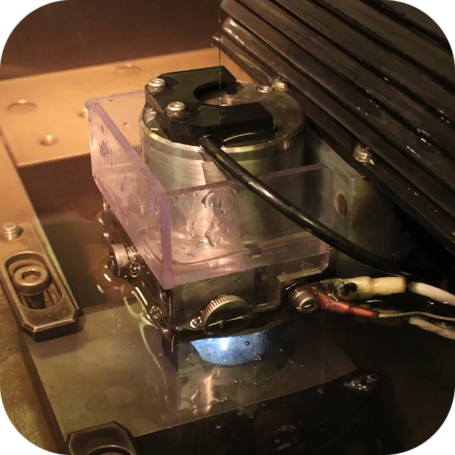 Fanuc wire EDM machine cutting a hardened tool steel detail